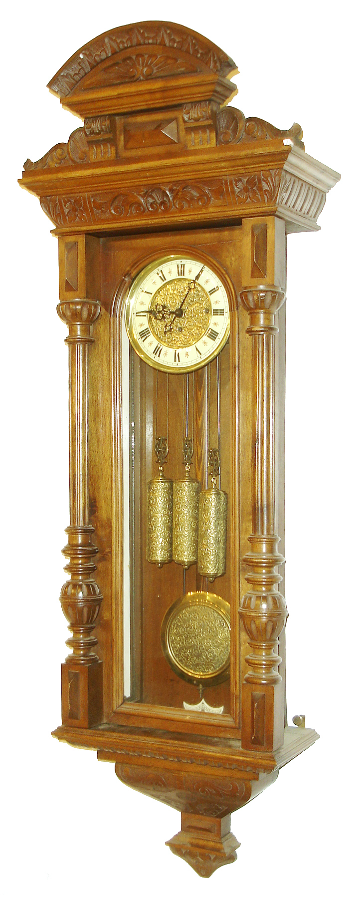 Gustav Becker, Freiburg, Germany, Vienna Regulator in the Altdeutsch style, 8 days, time and grande sonnerie strike, three weight driven movement in a carved walnut case with multicolor enamel dial and engraved brass center, matching engraved pendulum bob and weights, c1880 — Antique Clocks Price Guide