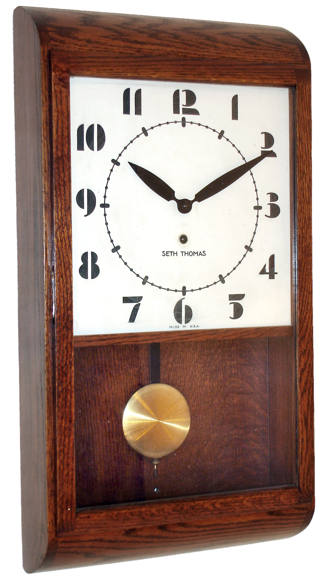 Seth Thomas Clock Co., Thomaston, Conn., Deco-style 8 days, time only oak wall clock dated 1946. — Antique Clocks Price Guide