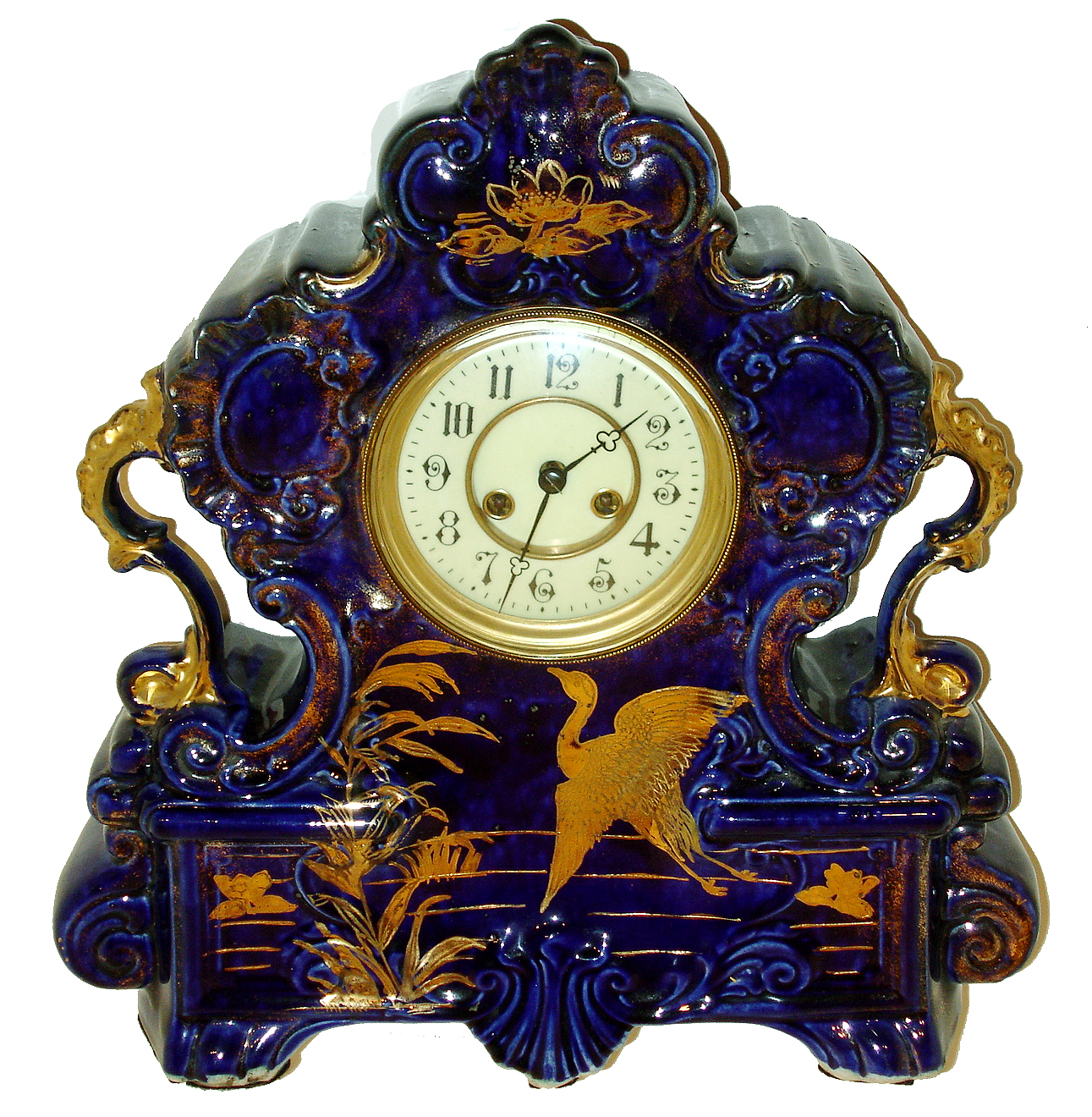 French mantel clock, cobalt blue glazed earthenware case with gilt ornament marked "England", Arabic numeral white enamel dial with sunk center, blued steel trefoil hands, gilt bezel with convex beveled glass, square plate 8 days, time and strike, movement, c1910 — Antique Clocks Price Guide