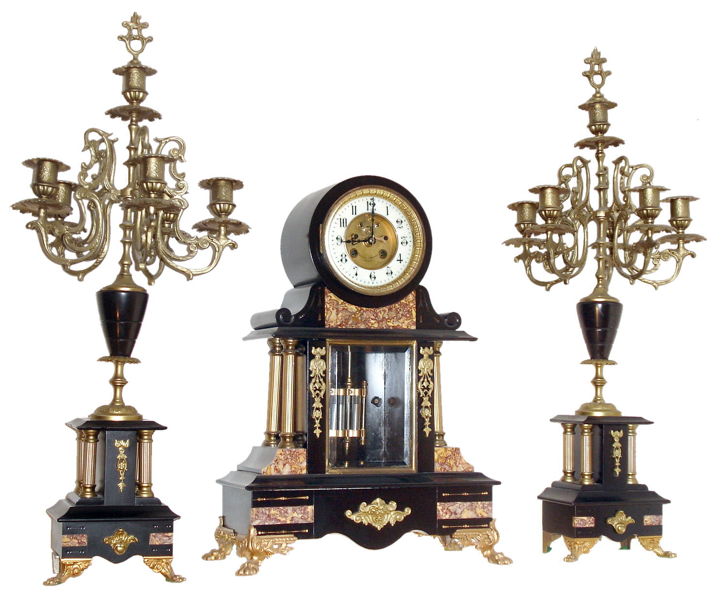France, 3 piece mantel garniture, black slate drumhead case with columns and inset contrasting marble panels, the case front with beveled glass, applied gilt spelter ornament and animal paw feet, Arabic numeral white enamel dial with sunken center, signed "Philippe &amp; Boisseri Rouen", Brocot open escapement, blued steel hands, 8 days, time and strike, Pendule a Paris movement signed Marti, faux mercury pendulum, with two candelabras of matching materials, design and ornament, c1880 — Antique Clocks Price Guide