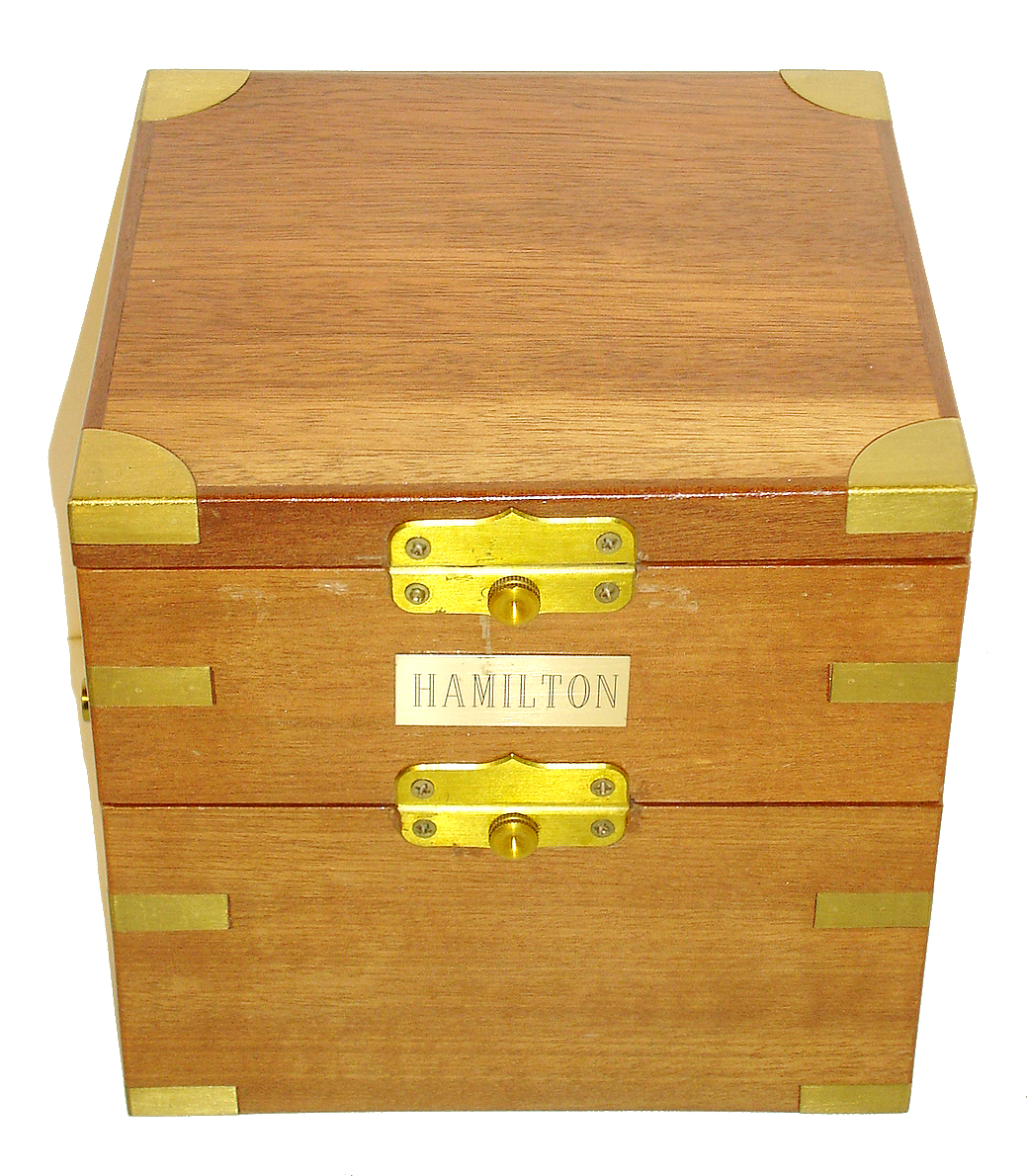 Hamilton Watch Co., Lancaster, Penn., model 21 marine chronometer, 14 jewel key wind and set, straight line damascened nickel plate movement, with spring detent escapement and chronometer balance with helical hairspring, in a gimbaled brass bowl with screw bezel, contained in a later mahogany box with brass hardware, and Arabic numeral, metal dial with wind indicator, black painted steel spade and poker hands, with key, serial #2E1073, c1941 — Antique Clocks Price Guide