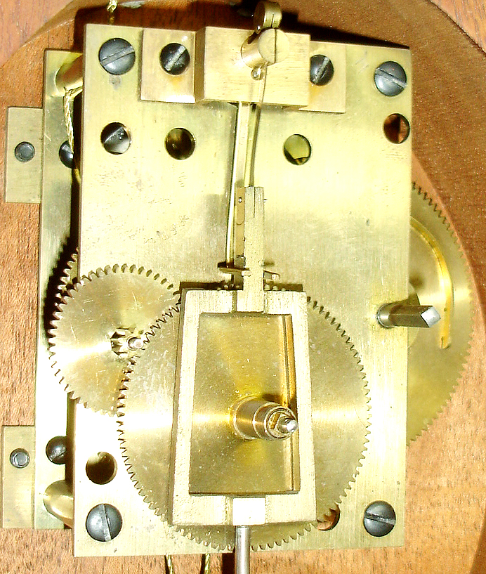 E. Howard &amp; Co., Boston, reissue presentation banjo wall clock, mahogany case with line inlay and cross banding with carved bracket, acorn drop and with eagle finial, Mt. Vernon tablet and Washington portrait throat glass, brass bezel and side arms, convex glass, Roman numeral white painted metal dial, brass timepiece movement with uncrossed wheels, lead weight, brass pendulum, movement number M5B55, c1990 — Antique Clocks Price Guide