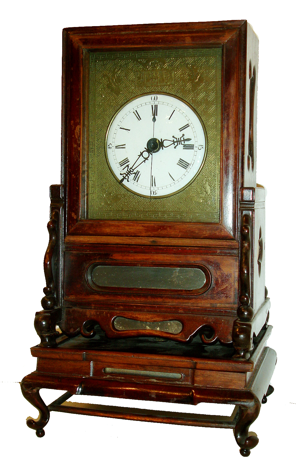 Chinese bracket clock, the 3 part case of carved camphor wood, base cabriole legs and rotating table, front of base and lower case set with mirrored panels, lower case also with quatrefoil cutouts at sides and backed with soapstone or alabaster, upper case with glazes sides to enable viewing of movement, Roman numeral white enamel dial, blued steel hands, cast and engraved dial surround, 8 days, time and strike, fusee movement with verge escapement, Chinese characters engraved on back plate, movement mounting brackets also with engraving, 19th century — Antique Clocks Price Guide