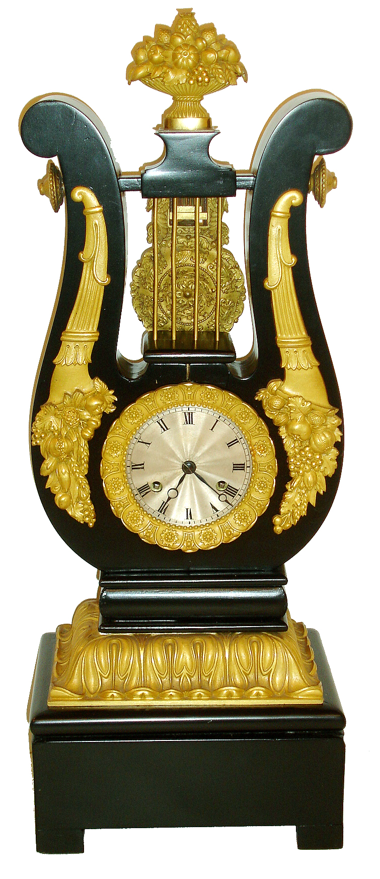 French mantel clock, ebonized wooden lyre form case with pendulum oscillating behind the "strings", ornamented with gilt mounts of waterleaf, horn of plenty and with an overflowing fruit basket at top, petal form bezel with floral ornament, pendulum decorated with cornucopiae, swans, acanthus, and with central floral medallion, 8 days, time and strike, Pendule a Paris movement, Roman numeral, engine turned silvered dial, blued steel Breguet style hands, c1830 — Antique Clocks Price Guide