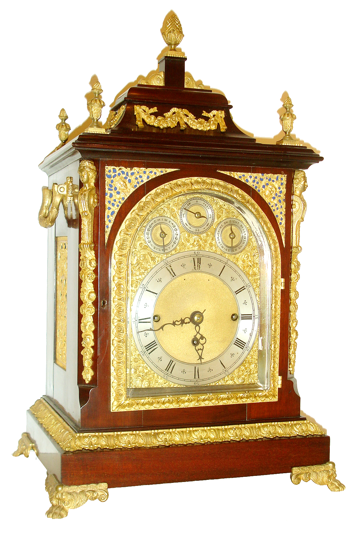 England, triple fusee bracket clock, Georgian style mahogany case with ornate gilt bronze mounts, paw feet, caryatid corners, acanthus leaf decorated base molding and door, the top with urn finials and floral swags and with central pineapple finial, the sides with large handles and pierced cast frets, composite dial with subsidiary dials at top for chime/ silent, regulation, and chime selection, blued steel hands, substantial 8 days, movement with Westminster chime on gongs or chiming on 8 bells, and counting the hours on a large gong, c1890 — Antique Clocks Price Guide