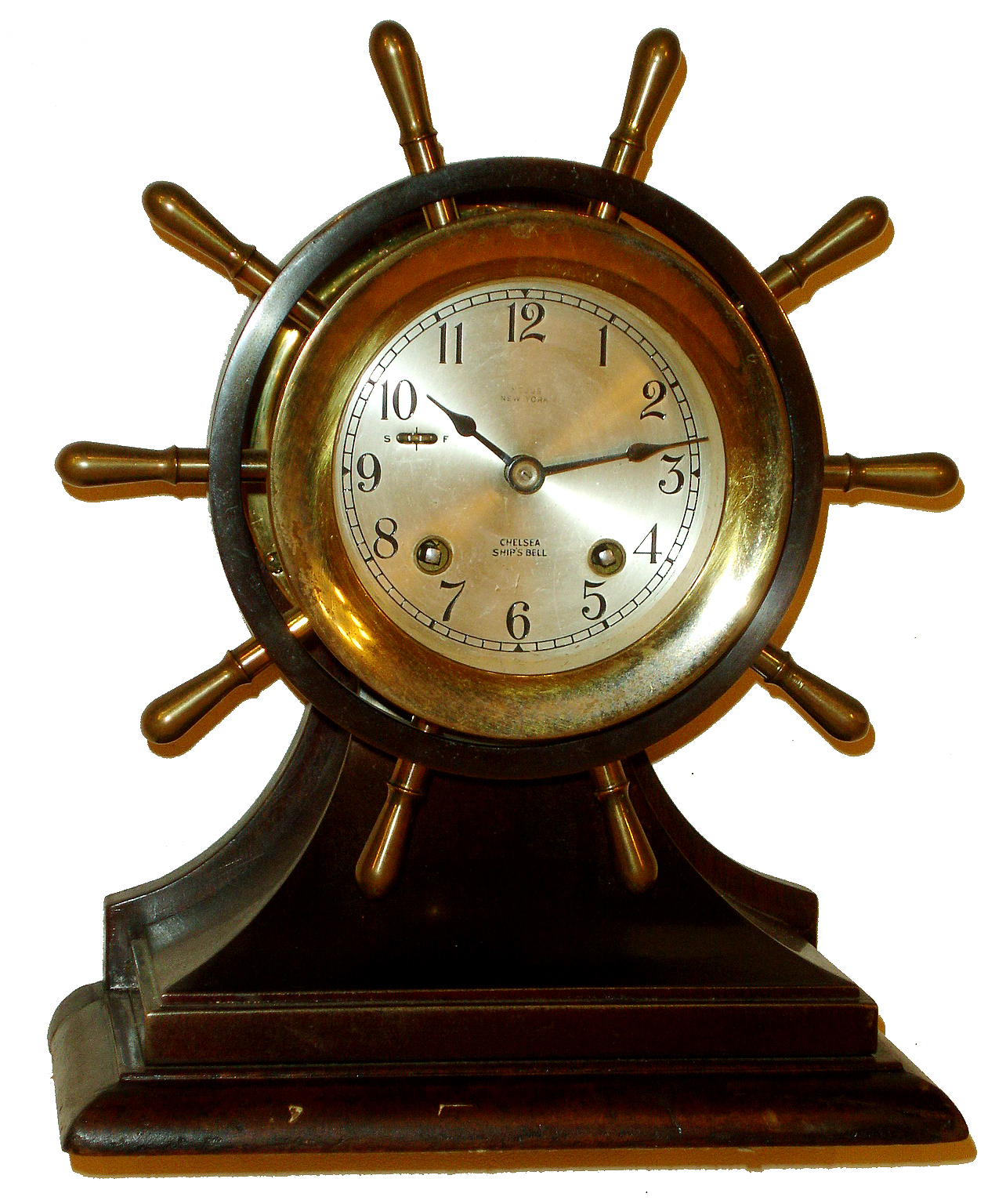 Chelsea Clock Co., Boston, for Negus, New York, 4" dial "Yacht Wheel" 8 days, ship's bells bronze, brass and mahogany hinged bezel mantel clock, #605437, c1957 — Antique Clocks Price Guide