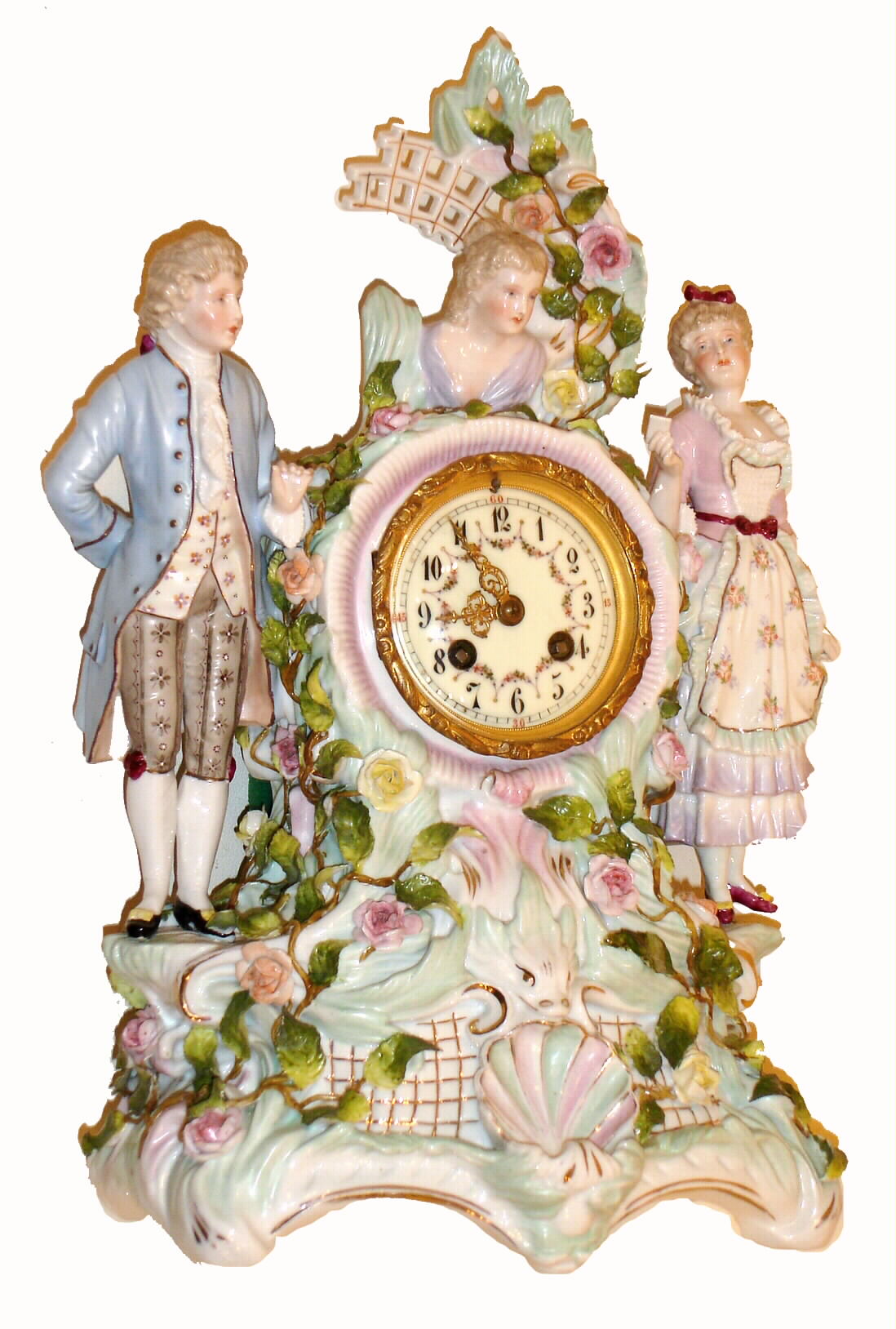 French, for J. E. Caldwell, Philadelphia, fine porcelain china bride's clock, showing Mom &amp; Dad to the sides and with bust of daughter at top, the mother holding a tablet with vows, the whole surround by flowers with fine individual petals, and the quality 8 days, bell strike movement by S. Marti, with Caldwell info, c1890 — Antique Clocks Price Guide