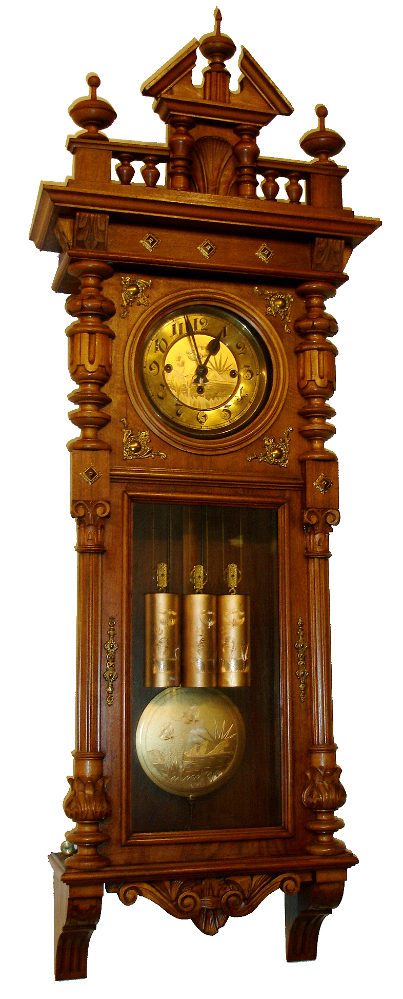 German, 3-weight grand sonnerie wall clock in a walnut porthole style case with pressed brass trimmings, and with engraved dial center, pendulum and weights, all matching with double tulips, striking the quarters on two long rods, c1890 — Antique Clocks Price Guide