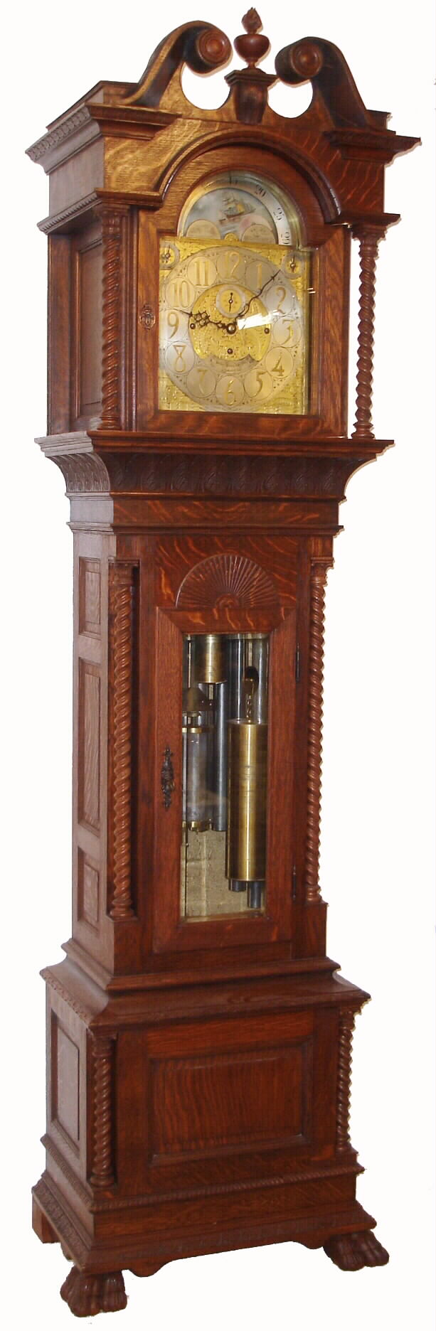 Walter H. Durfee, Providence, Rhode Island, for Bailey, Banks &amp; Biddle, Philadelphia, Penn. on dial, 9 tube hall clock, 8 days, time, strike and 1/4 chime three weight driven movement playing Westminster or Whittington tune on tubes signed by Walter Durfee with patent date 1887 and with single jar mercury pendulum. The silvered brass dial has moon phase with elk scene, strike / silent and tune selector discs. The case is oak with a dark walnut finish and has carved cornice moldings, carved paw feet, broken arch top, 11 raised panels, barley twist columns, of which four are flanking the trunk and two are flanking hood, sunburst carving above trunk door and beveled glass in hood and trunk doors. There are exceptional lion's head escutcheons on both hood and trunk doors, c1895 — Antique Clocks Price Guide