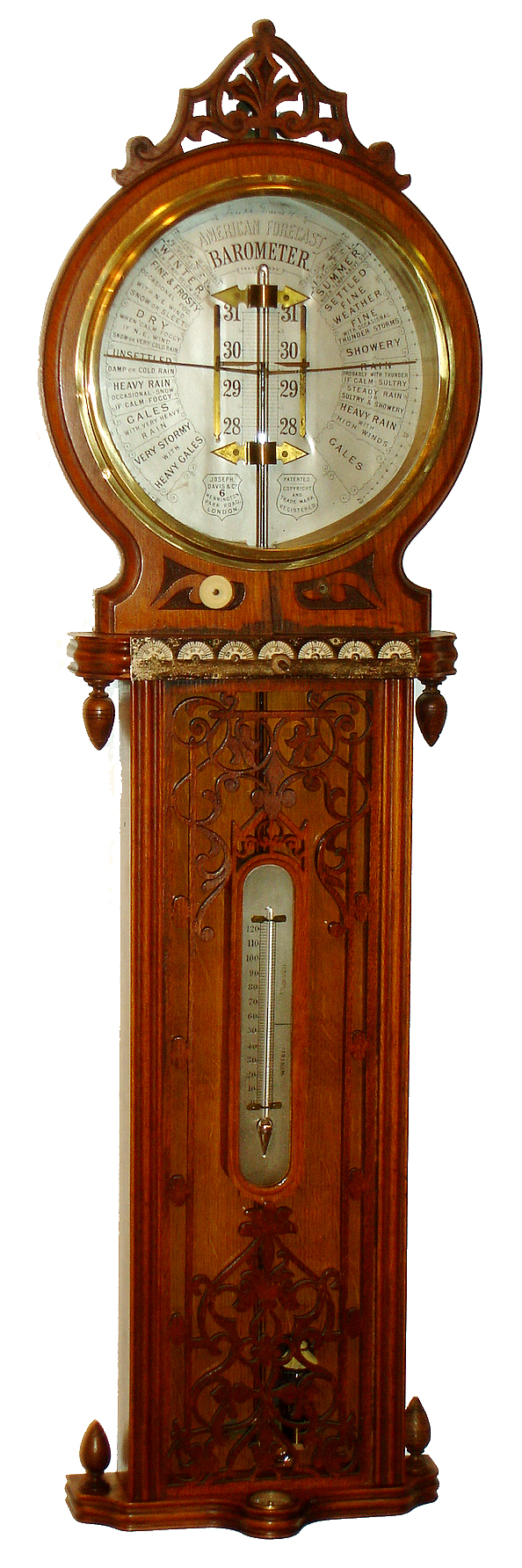 Joseph Davis &amp; Co., 6 Kennington Park Road, London, England, "American Forecast Barometer", large bore mercury tube, thermometer, compass, and seven dials (one for each day of the week) to record barometric pressure in an ornate highly carved hard wood case with elaborate fretwork on inside and outside of lower glass, silvered dial and thermometer and ivory daily dials, c1890 — Antique Clocks Price Guide