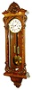 Germany or Austria, Vienna Regulator wall clock, 8 days, time and strike, weight driven movement in a carved and burled hard wood case with white enamel dial, brass weights and pendulum bob, c1870