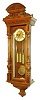 Gustav Becker, Freiburg, Germany, Vienna Regulator in the Altdeutsch style, 8 days, time and grande sonnerie strike, three weight driven movement in a carved walnut case with multicolor enamel dial and engraved brass center, matching engraved pendulum bob and weights, c1880