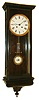 Germany, Vienna style wall regulator, 8 days, time and strike, spring driven movement in a transitional Biedermeier style walnut case with graining and ripple molding and white enamel dial and white enamel R/A pendulum bob, c1860