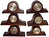 Clocks- 13 (Thirteen) Tambour German and English wood case 8 days, mantel clocks (6 three-train Westminster chime, 7 two train time and strike); 1 aneroid barometer on carved wood stand; one French front (no movement) for "Chocolat Revillon"; 1 porcelain Delft style wall clock with time-only pin-pallet works mounted behind; early 20th century