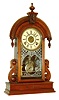 Waterbury Clock Co., Waterbury, Conn., "Paris", 8 days, time, strike and alarm walnut mantel clock, c1881