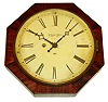 Marine Clock Manufacturing Co., New Haven, Conn., "Kirk's Patent" wall clock, 30 hours, time and strike, spring driven movement with double escape wheel and cast iron back plate in a mahogany veneered octagonal case with painted metal dial, c1850