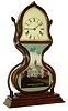 J.C. Brown, Bristol, Conn., "Acorn" mantel clock, 8 days, time and strike, spring driven fusee movement in a laminated and rosewood veneered case with reverse painted tablet and painted metal dial, c1847