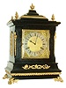New Haven Clock Co., New Haven, Conn., mantel clock "Chime No. 4", mantel clock in a bracket style case with cast ornament Roman numeral composite dial, 8 days, time and strike, movement, with separate chime movement, playing Westminster chimes on gongs,