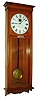Self Winding Clock Co., New York, N.Y., "No. 9 Self Winding Regulator" wall clock, time only, electric movement with a 60 beat pendulum in an oak case with painted metal dial, c1908