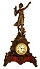 Ansonia Clock Co., New York, "Cymric" Art Nouveau style cast metal figural clock No. 1173 with "Grecian Verde" finish on red painted metal marbleized base, c1904