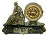 Ansonia Clock Co, Ansonia, Conn.figural mantel clock with number 1028 "Queen" figure on a "Newton" base, 8 days, time and strike, visible escapement, c1894. Base is cast iron and the statute and applied ornament are spelter.
