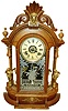 Ansonia Clock Co, Brooklyn, NY "Triumph" mirror sided mantel clock in oak case, 8 days, time, strike and alarm, c1880