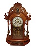 New Haven Clock Co., New Haven, Conn., "Occidental" 8 days, time, strike and alarm mirror sided mantel clock, walnut case, c1895.