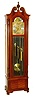 Herschede Clock Co., Cincinnati, Ohio, Colonial style 9 tube hall clock, 8 days, time, strike and chime, three weight driven movement playing three tunes, Westminster, Wittington, Canterbury in a mahogany case with fluted full Corinthian columns on sides, bracket feet and beveled glass on trunk and sides. and herring bone panel on base. The silvered dial has applied brass Arabic numerals, brass corner and center spandrels and moon phase, c1960