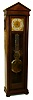Colonial Manufacturing Co., Zeeland, Mich., "The Judge" tall clock, 8 days, time only, weight driven Swiss style pinwheel escapement movement in an architectural mahogany case with full columns and lower beveled glass and brass dial with sweep seconds hand and silvered chapter ring, c1920