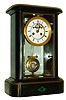 France, black slate mantel clock, case with incised ornament and inlaid malachite panel at base with brass molding between lower and upper case, rounded corners, projecting top with molded edge, beveled glass front and back doors, Roman numeral white enamel dial with sunk center, Brocot open escapement, blued steel Breguet style hands, 8 days, time and strike, Pendule a Paris movement signed Marti, gilt Ellicott compensating pendulum, c1870