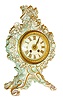 French mantel clock, high quality porcelain case with crossed swords mark, possibly Meissen, rococo style with foliate and naturalistic ornament, the top with trailing vines and many applied flowers, case with pink, aqua, and gold highlights, gilt bezel with beveled convex glass, porcelain dial with gold Roman numerals, gilt hands, rear bezel with frosted glass, 8 days, time and strike, Pendule a Paris movement, c1870