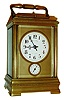 French petit sonnerie striking carriage clock with alarm for G.W. Russell, Philadelphia, gilt brass case with beaded trim, beveled glass panels, Arabic numeral white enamel dial with gilt mask, blued steel hands, 8 days, time and strike, movement with lever platform, striking the hours, petit sonnerie quarters, and repeating the last hour and quarter on demand, with velvet lined leather bound travel case, c1910