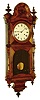 Welch, Spring & Co., Forestville, Conn., "Regulator No. 4" wall clock, 30 days, time only, double spring driven, nickel plated movement with club foot escape wheel in a black walnut case with turned columns and finials, black flocking on backboard and painted metal dial, c1874
