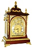 England, triple fusee bracket clock, Georgian style mahogany case with ornate gilt bronze mounts, paw feet, caryatid corners, acanthus leaf decorated base molding and door, the top with urn finials and floral swags and with central pineapple finial, the sides with large handles and pierced cast frets, composite dial with subsidiary dials at top for chime/ silent, regulation, and chime selection, blued steel hands, substantial 8 days, movement with Westminster chime on gongs or chiming on 8 bells, and counting the hours on a large gong, c1890