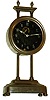 Gravity Clock, European, 30 hours, with exposed compound pendulum visible through the glass dial. Movement is in a nickel plated canister that is raised on toothed post to wind, c1922