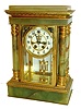 Gilbert Clock Co., Winsted, Conn., Magdalene variant crystal regulator, green onyx case with gilt brass mounts, beveled glasses, Arabic numeral white enamel dial with sunk center, exposed escapement and beat adjustment, blued steel hands, 8 days, time and strike, movement with round plates, faux mercury pendulum, c1915