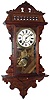 Waterbury Clock Co., Waterbury, Conn., "Lawrence" walnut 8 days, time and strike, hanging gingerbread wall clock, c1891