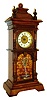 German, Novelty Waterfall or fountain clock. The miniature tall style case with timepiece movement at top, and a separate spring driven movement in the bottom, actuated at will to drive the twisty glass rod that simulates water, c1900