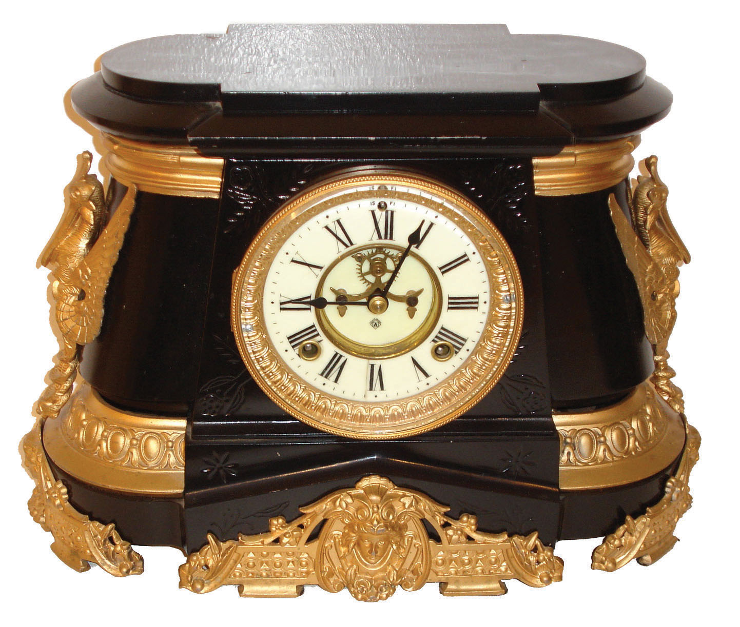 Ansonia Clock Co., New York, "Pompeii" model spring driven 8 days, time and strike, (hour &amp; half hour on gong) clock in an enameled iron case with a porcelain dial, visible escapement and white metal style case ornaments, c1904. — Antique Clocks Price Guide