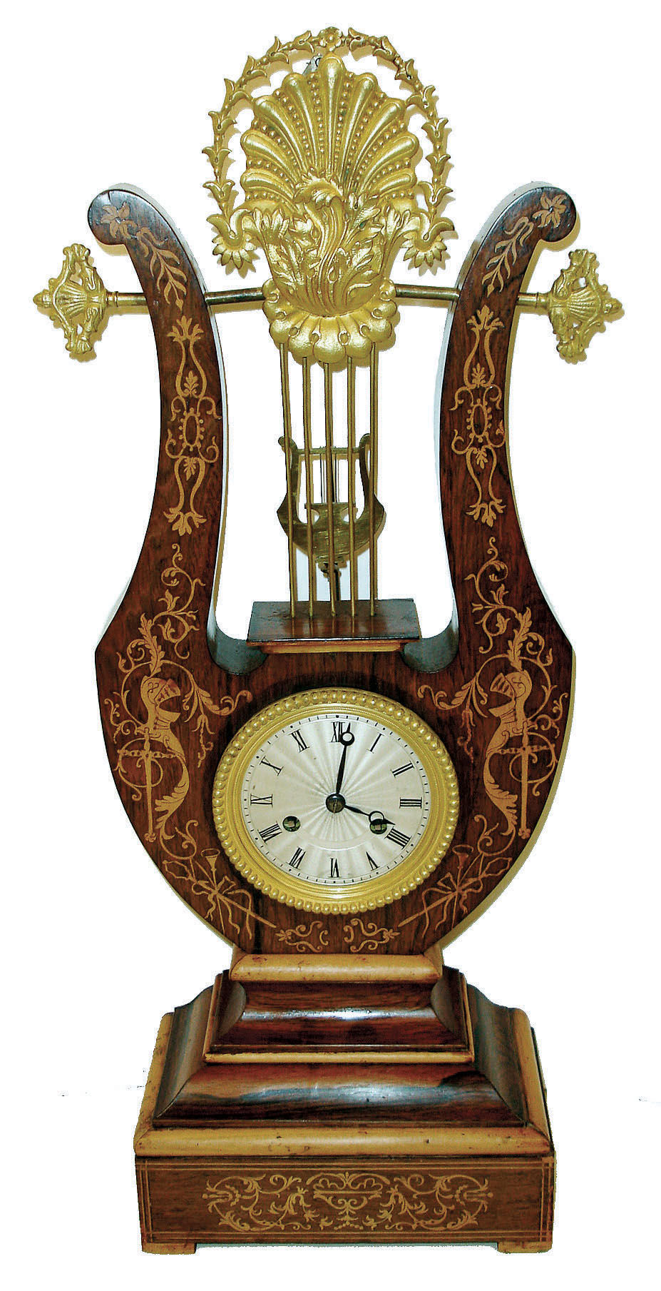 Grange &amp; Betout a Paris, inverted lyre clock, rosewood veneered case with light wood inlays and moldings, top with gilt shell and leaf form ornament, gilt beaded bezel, Roman numeral silvered dial with engine turning, blued steel Breguet style hands, lyre form pendulum swinging above the dial and behind lyre strings, 8 days, time and strike, pendule a Paris movement signed "Grange &amp; Betout A Paris", c1860 — Antique Clocks Price Guide