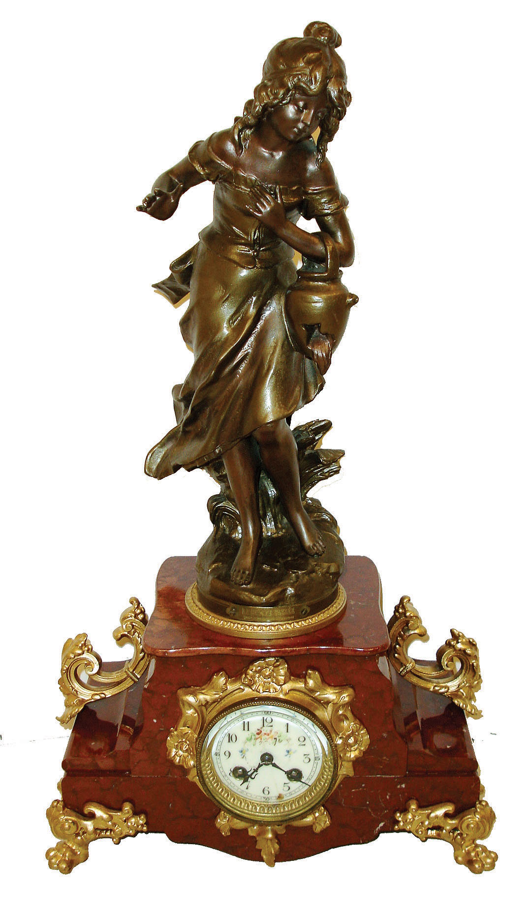 France, figural mantel clock "La Cruche Cassee" or the broken jug, shaped red marble case with gilt paw feet and side ornaments, gilt dial surround, gilt bezel with beveled glass, top with patinated female figure carrying a damaged jug, leaking its contents, the base with engraved plaque "La Cruche Cassee par Francois Moreau", Arabic numeral white enamel dial, blued steel hands, 8 days, time and strike, pendule a Paris movement, c1900 — Antique Clocks Price Guide