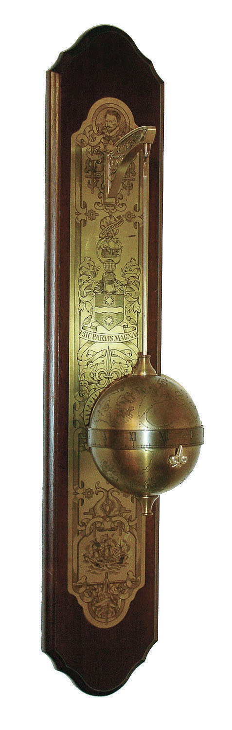 Thwaites &amp; Reed, England for the Franklin Mint, Sir Francis Drake falling ball gravity clock, the spherical weighted engraved brass case containing the 8 day timepiece movement and with annular time display, suspended from a bracket affixed to a wall mounted board with engraved ornamental brass back plate, c1980 — Antique Clocks Price Guide