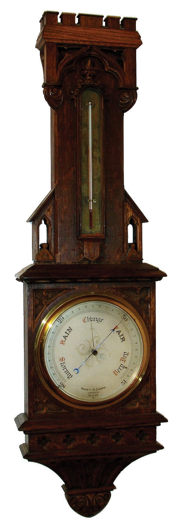 Negretti and Zambra, London, aneroid barometer and thermometer, the ornate carved oak case in the Gothic style, thermometer with silvered scale, barometer with engraved, silvered dial with blued steel indicator and gilt set hand, and signed Negretti &amp; Zambra, London, No. 4190, c1900 — Antique Clocks Price Guide