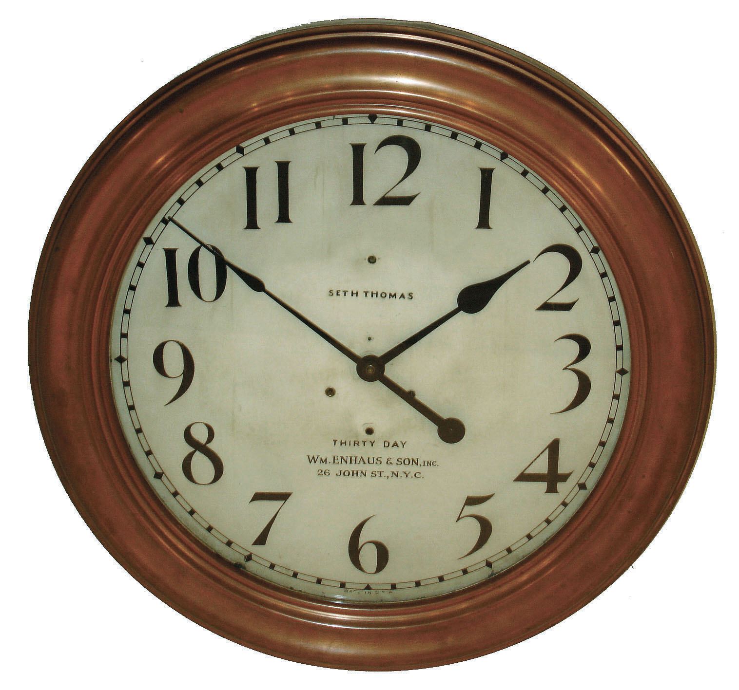 Seth Thomas Clock Co., for "Wm. Enhaus &amp; Son, Inc., 26 John St., N.Y.C." 30 day time only, round copper-clad gallery clock with #86U twin-spring time only, movement, c1910 — Antique Clocks Price Guide