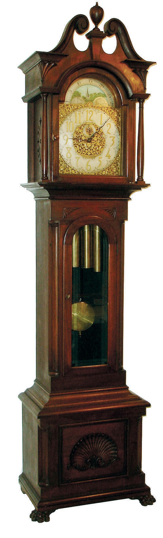 Seth Thomas Clock Co., Thomaston, Conn., tall clock, 8 days, weight driven time &amp; quarter chiming on four bells and striking on cathedral gong, case with beveled door glass and turned full columns on hood. Brass dial with applied cast brass spandrels and engraved center, silvered chapter with applied brass numerals and moon phase, c1900 — Antique Clocks Price Guide