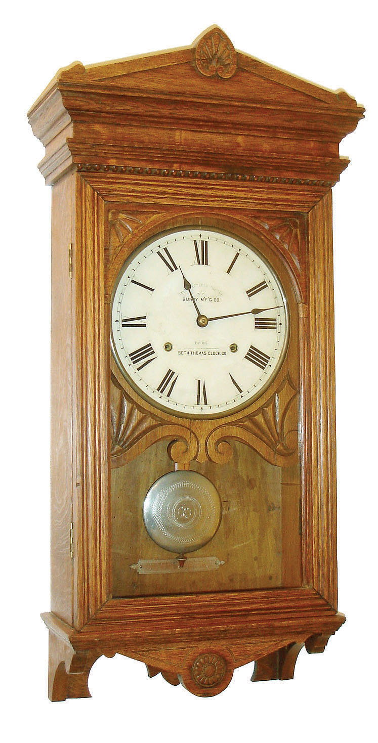 Seth Thomas Bundy time recorder wall clock, oak case with lower half missing, and the bottom attached to the shortened case, Roman numeral paper dial, steel spade hands, damascened nickel pendulum, 15 or 30 day timepiece movement, c1900 — Antique Clocks Price Guide