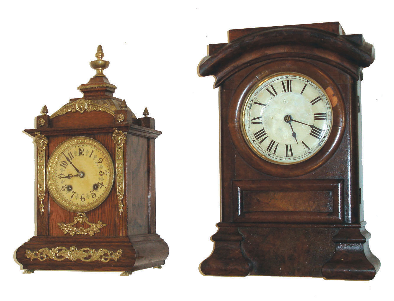 Clocks- 2 (Two) Connecticut Shelf: (1) New Haven Clock Co., New Haven, Conn., "Lurine" model spring driven 15 day time and strike (hour and half hour on cathedral gong) in oak case, c1889.  (2) Seth Thomas Clock Co., Thomaston, Conn., "Arch Top" model spring driven 8 days, time and strike, in burl walnut case, c1885. — Antique Clocks Price Guide