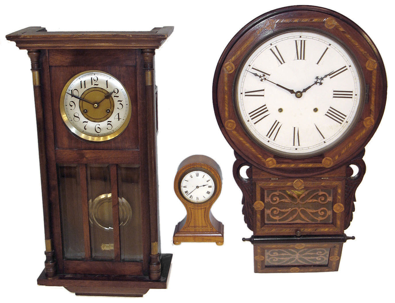 Clocks- 3 (Three): Anglo-American 8 days, time and strike, inlaid wall clock; German 8 days, time and strike, walnut box regulator; french small solid grained hardwood balloon case desk clock with cylinder escapement; early 20th century — Antique Clocks Price Guide