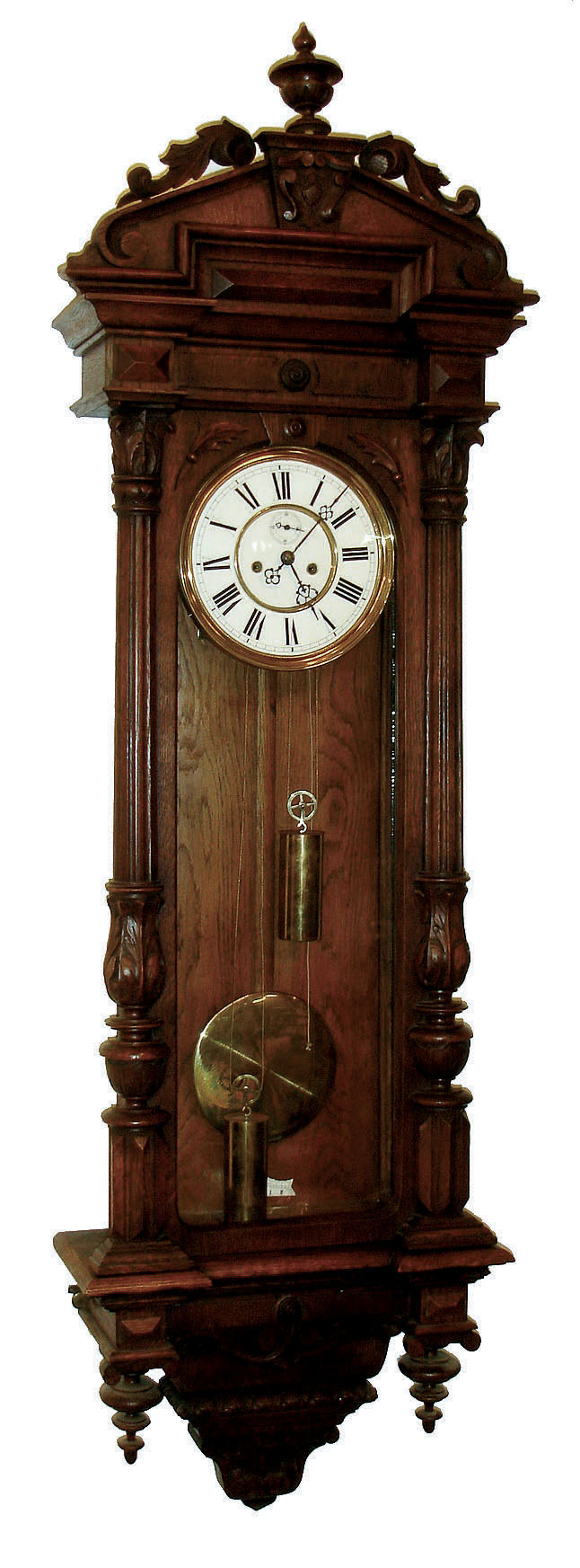 Austria, Vienna regulator, oak case with carved scrolls and leaves, turned finials and architectural ornament, Roman numeral white enamel dial with small seconds below 12:00, pierced blued steel hands, brass 8 days, time and strike, movement, polished brass pendulum and weights, c1890 — Antique Clocks Price Guide