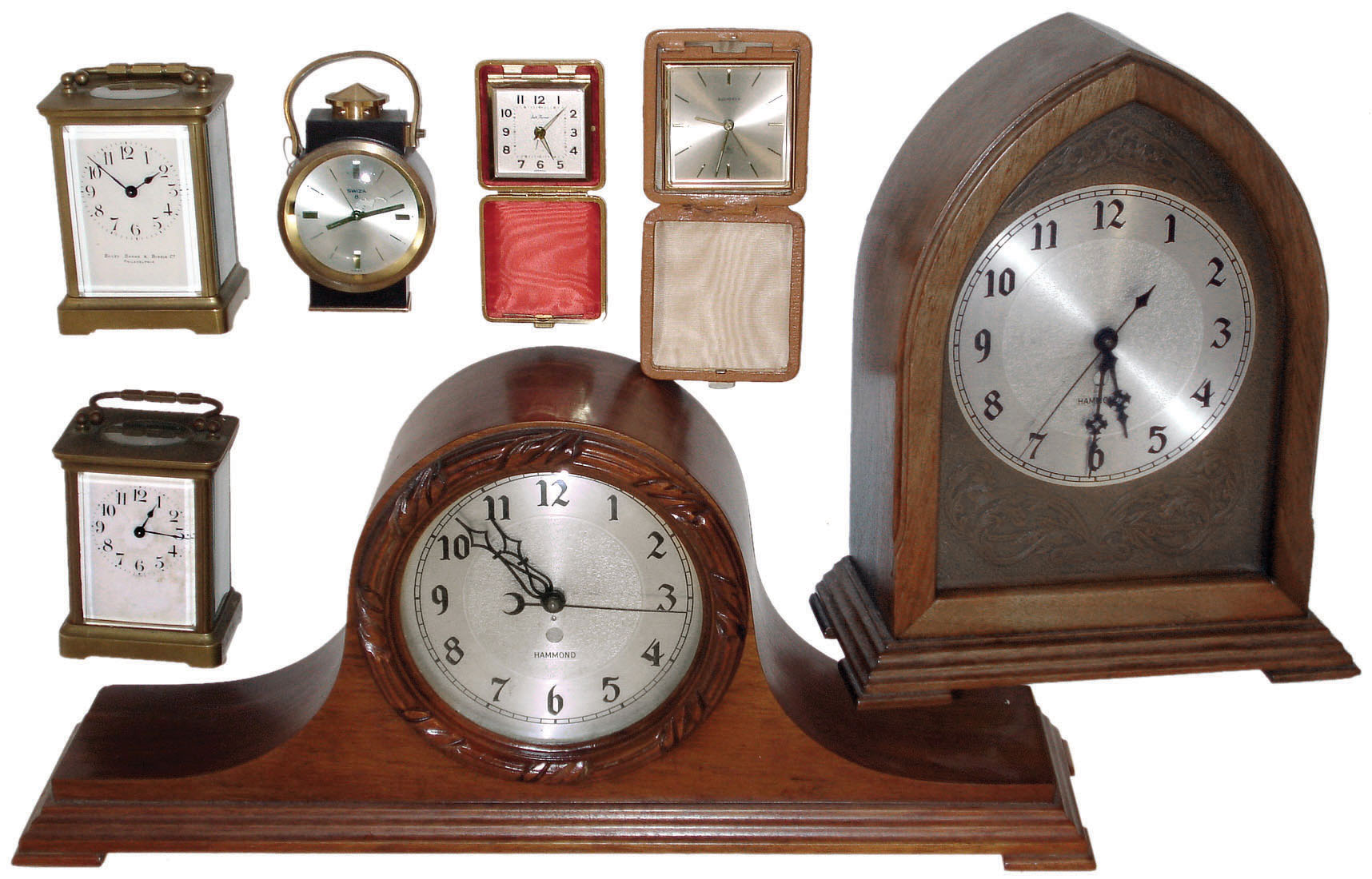 Clocks- 7 (Seven): two Hammond plug-in electrics; two leather-case travel clocks, one by Bucherer; two French time-only brass and glass carriage clocks; Swiza brass alarm clock; 20th century — Antique Clocks Price Guide